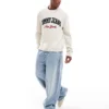 Tommy Jeans Varsity Logo Jumper In Off White For Men Newsprint
