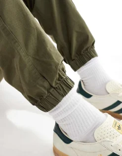 Tommy Jeans Ryan Cargo Trousers In Olive Green For Men Fatigue Green -Tomeans Store 207286296 3